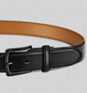 Men's genuine leather belt, sleek black design, durable buckle, versatile for casual and formal wear.